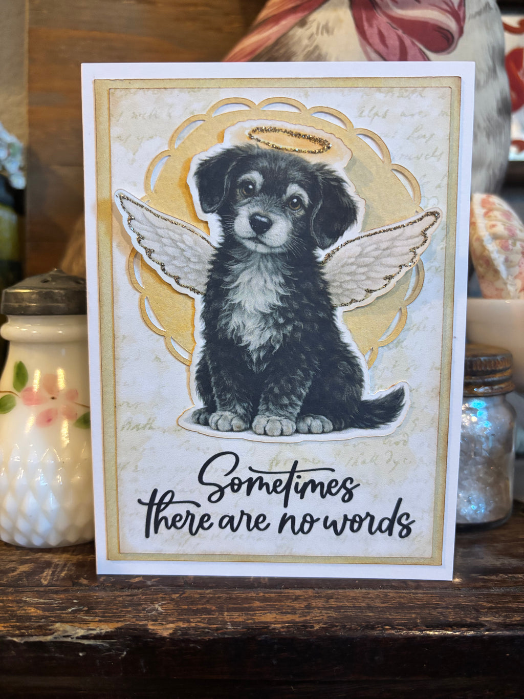 Card with a dog with angel wings and a halo illustration, and 'Sometimes there are no words' text on the front of the card.
