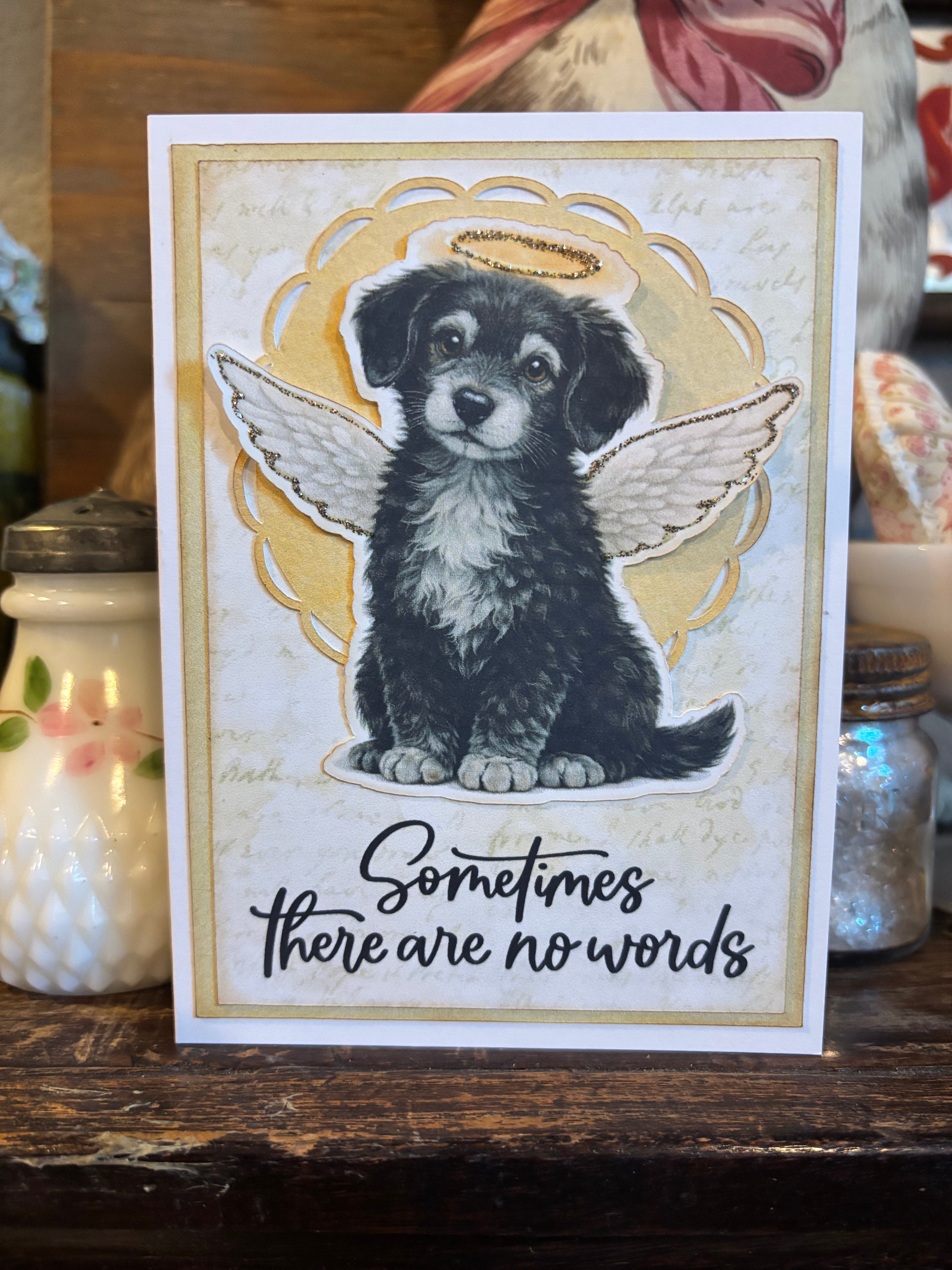 Card with a dog with angel wings and a halo illustration, and 'Sometimes there are no words' text on the front of the card.